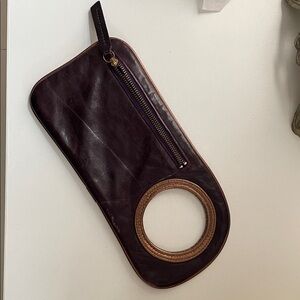 Purple leather wristlet by Arzadesigns.